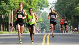 PHOTO: Luke Puskedra, Girma Mecheso and Christo Landry fight for the win at the 37th annual Faxon Law New Haven Road Race  (photo by Jane Monti for Race Results Weekly). 