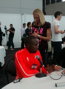 Geoffrey Mutai with Paula Radcliffe in the Background