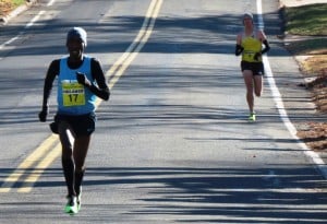 Sam Chelanga (left) pulls away from Aaron Braun to win the 2013 Manchester Road Race (Photo by Jane Monti for Race Results Weekly)