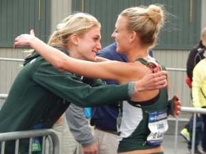 Rachele Schulist embraces Leah O'Connor after the latter's NCAA steeple title in June