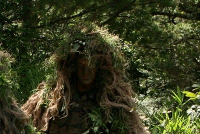 Occasionally, Cormier donned a ghillie suit in his work as a sniper.