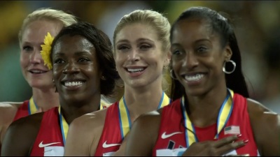 Four happy faces during The Star-Spangled Banner