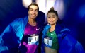 Donn Cabral and Alexi Pappas celebrate their victories at the 2015 NYRR Dash to the Finish Line 5-K by modeling their TCS New York City Marathon capes (photo by Chris Lotsbom for Race Results Weekly)