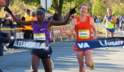 Sam Chelanga (left) edges Tyler Pennel at the finish line of the 2015 .US 12-K National Road Racing Championships in Alexandria, Va.; both men were timed in 34:35 (photo by Jane Monti for Race Results Weekly)