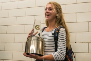 Katie Rainsberger of Air Academy High School (Colorado Springs, CO) poses with her Gatorade National Girls Cross Country Runner of the Year award at her school on Thursday, January 21, 2016. Photo Credit/Gatorade.