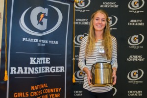 Katie Rainsberger of Air Academy High School (Colorado Springs, CO) poses with her Gatorade National Girls Cross Country Runner of the Year award during an assembly at her school on Thursday, January 21, 2016. Photo Credit/Gatorade. 