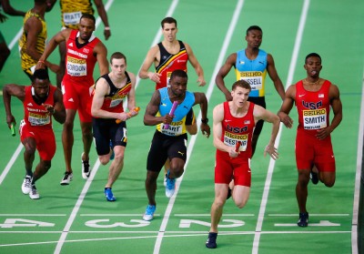 Christopher Giesting receives the baton from Calvin Smith (Photo by Christian Petersen/Getty Images for IAAF)"