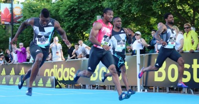 (left to right) Marvin Bracy of the United States, Yohan Blake of Jamaica, Akani Simbine of South Africa and Keston Bledman of Trinidad & Tobago compete in the 100m at the inaugural adidas Boston Boost Games (photo by Chris Lotsbom for Race Results Weekly)