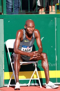 Bernard Lagat Sitting on A Bench after Dropping out while in 3rd