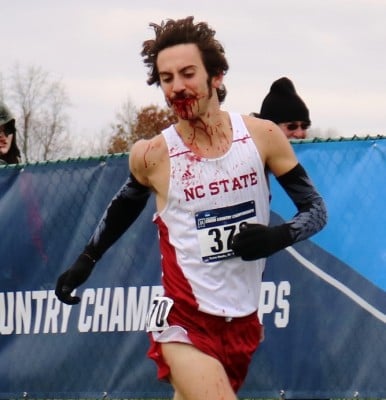 Eli Moskowitz of North Caroline State competing at the 2016 NCAA Division I Cross Country Championships after a bad fall (photo by Chris Lotsbom for Race Results Weekly)