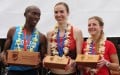 PHOTO: Edwin Kiptoo, Nicole Sifuentes (center) and Shannon Osika after receiving their top-3 awards at the inaugural Kalakaua Merrie Mile in Honolulu on 10 December, 2016 (Photo by Jane Monti for RaceResults Weekly)