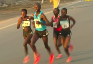 Male Pacer and 3 Women in Lead Pack (Jepchirchir on Left) 