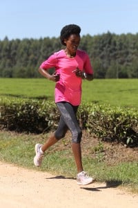 Jemima Sumgong running in the Nandi Hills (by Jean-Pierre Durand for the IAAF)