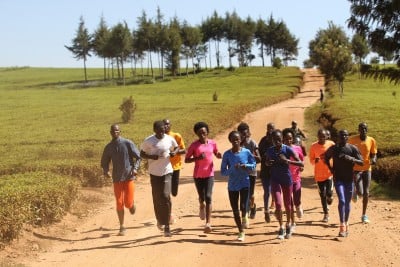 Sumgong (center in pink) on her training run with the Nandi tea plantations in the backdrop (photo from IAAF Day in the Life Project)