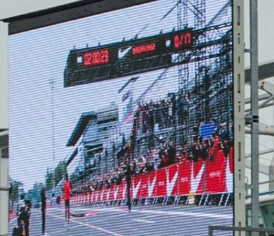 Blown up picture of video board in background showing 2:00:23