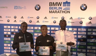  Eliud Kipchoge, Kenenisa Bekele and Wilson Kipsang pose for photographers before the 2017 BMW Berlin Marathon (photo by David Monti for Race Results Weekly)