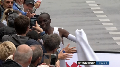Kipchoge celebrates with the fans