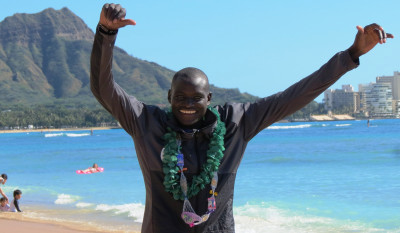 Marathon world record holder Dennis Kimetto of Kenya in advance of the 2017 Honolulu Marathon on Waikiki Beach (photo by Jane Monti for Race Results Weekly)