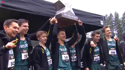 Colton Bogucki (center) almost dropped the trophy before hoisting it in Portland