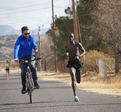 Haas monitoring one of Cheserek's workouts in Flagstaff