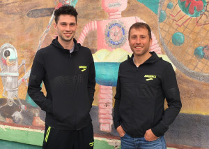 Drew Windle (left) and his coach Danny Mackey of the Brooks Beasts in Downtown Albuquerque on February 15, in advance of the 2018 USATF Indoor Track & Field Championships (photo by David Monti for Race Results Weekly)