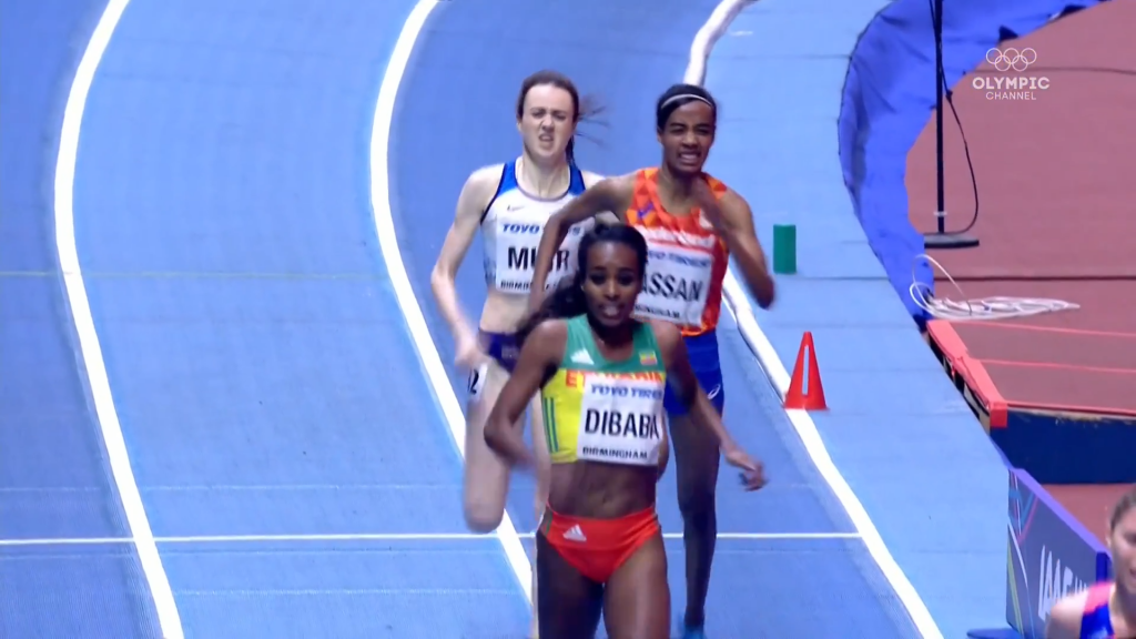 Dibaba drifts wide of lapped runner