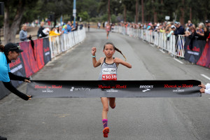 Arielle Avina from Murrieta, Cali. at the young age of 10-years-old dashes to the victory of the 2018 Synchrony Rock 'n' Roll San Diego 5K presented by Brooks. Avina became the youngest female ever to win a Rock 'n' Roll Marathon Series 5K event with a time of 19:21. (Photo credit Sean Haffey/Getty Images for Rock 'n' Roll Marathon Series)