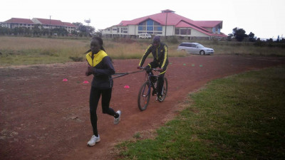 Sometimes Ouma has his athletes use a bicycle instead of the tire (courtesy Bernard Ouma)