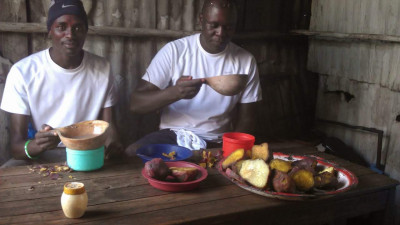 Manangoi and Ouma back in Kisumu enjoying a traditional breakfast of porridge and sweet potato