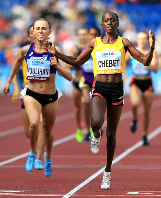 Chebet over Houlihan (Photo by Stephen Pond/Getty Images for IAAF)