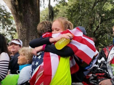 The Hiltons embrace after Nicks win at the 2014 Rock n Roll Savannah Marathon