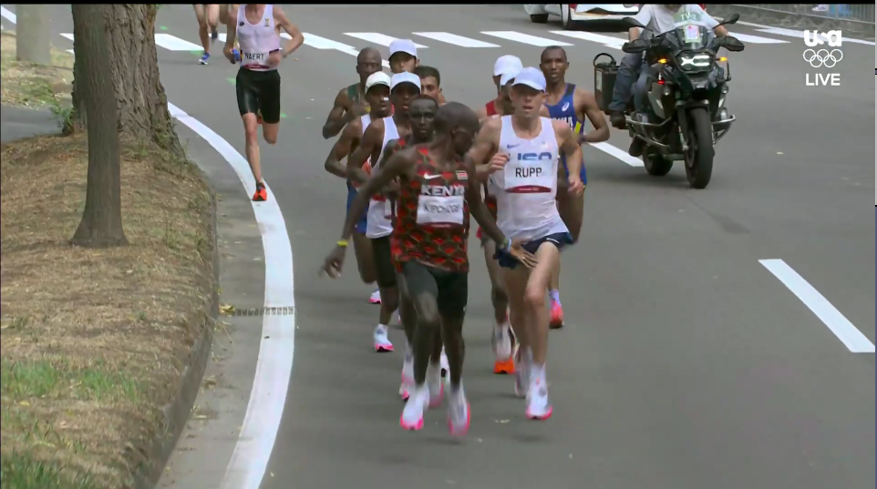 Kipchoge Gestures at Rupp 2020 Olympic Marathon