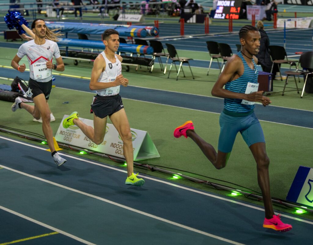 Grant Fisher right behind Girma early in the race (photo (c) Athle.ch)