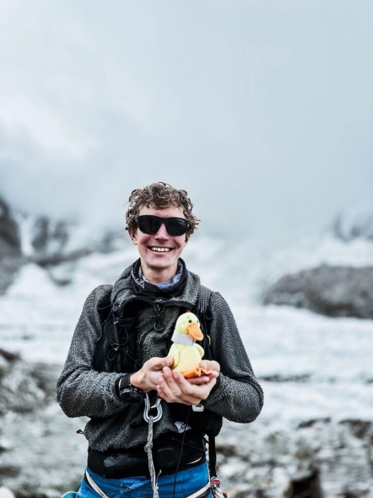 Tyler and Quackers, the childhood Beanie Baby, that has looked after him on his adventures around the world